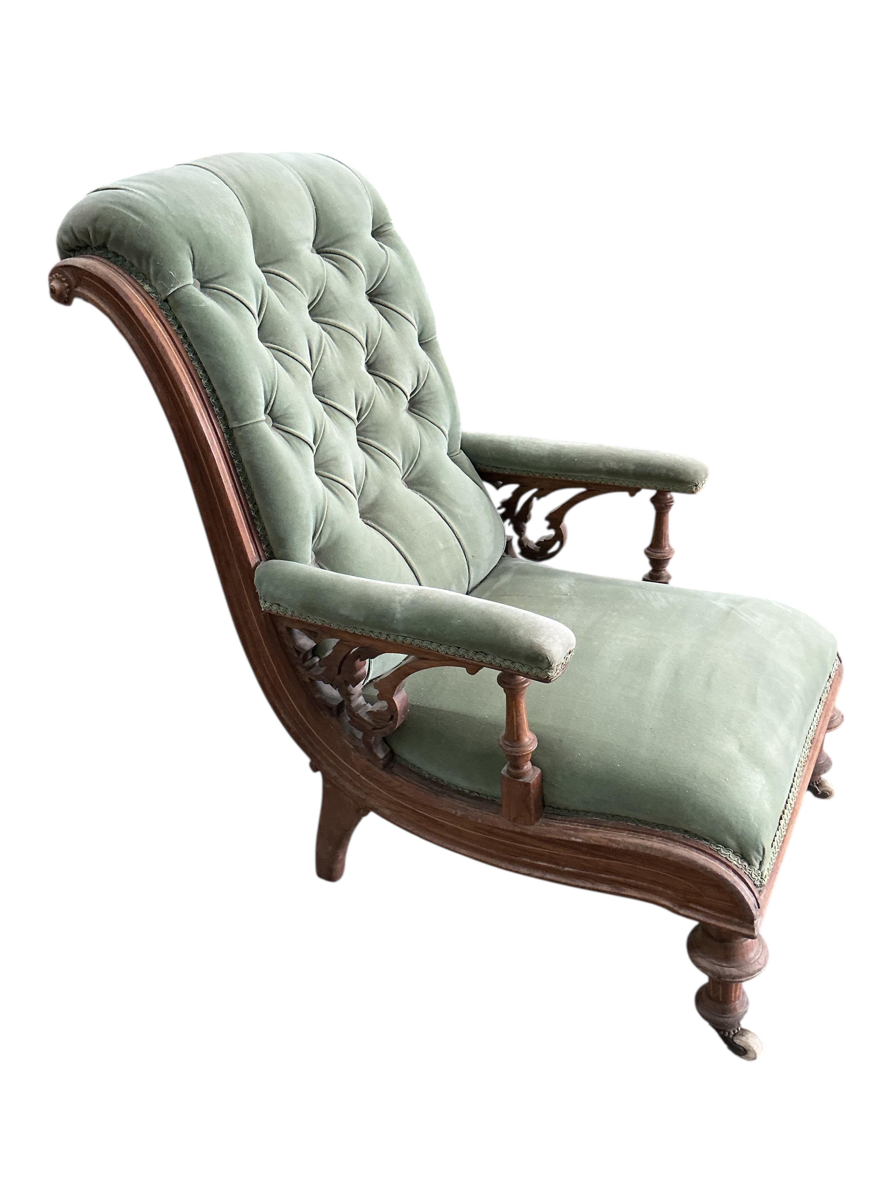 A late Victorian inlaid carved walnut armchair, width 58cm, depth 70cm, height 84cm